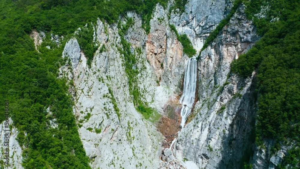Push Out Shot Of Highest, Majestic Boka Waterfall, Located in Huge Mountain Soča Valley on Beautiful Sunny Day, Between Cliffs, Surrounded With Hanging Green Forest, Huge Wall Mountain Stones, Canyons Push Out Shot Of Highest, Majestic Boka Waterfall, Located in Huge Mountain Soča Valley on Beautiful Sunny Day, Between Cliffs, Surrounded With Hanging Green Forest, Huge Wall Mountain Stones, Canyons
