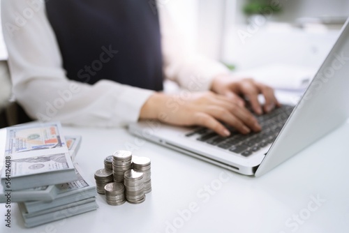 Businesswoman Accountant analyzing investment charts Invoice and pressing calculator buttons over documents. Accounting Bookkeeper Clerk  Bank Advisor And Auditor Concept