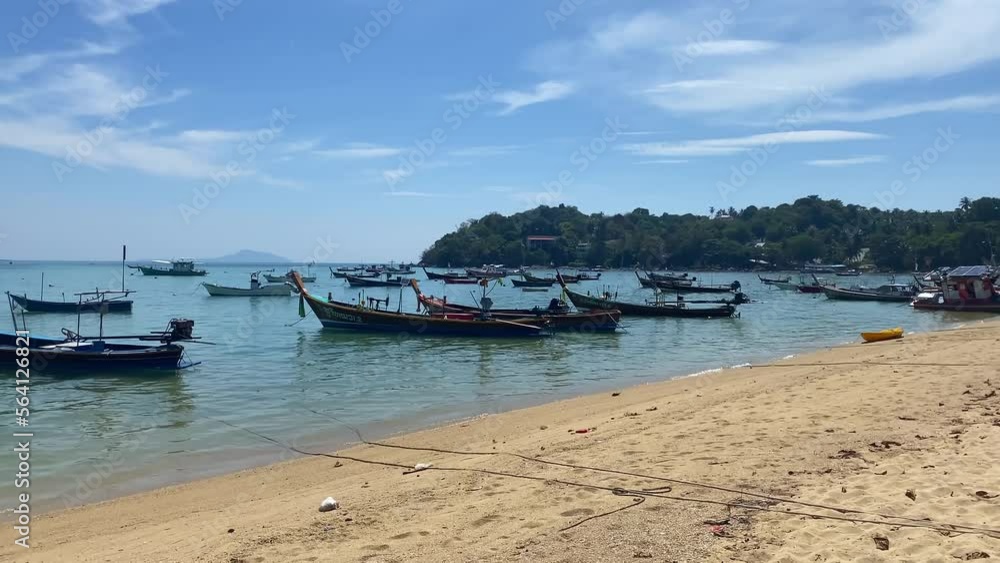 Wooden boats in the sea near the sandy beach. Wooden boats in the sea near the sandy beach.