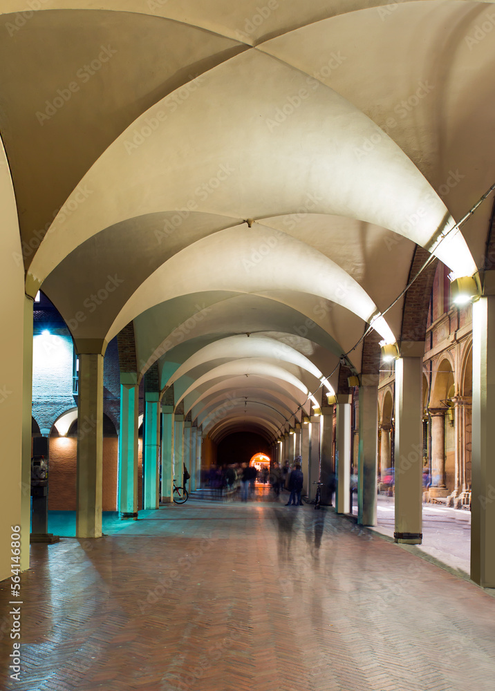 The characteristic porticoes of old town in the morning - Bologna, Italy
