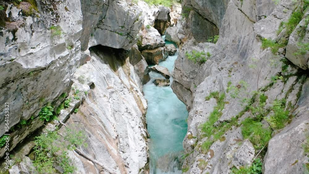 Flying in Middle Of Stunning and Unique Soca Gorge With Soca River Floating In It With Emerald Pools of Turquoise Water Throughout the River in Middle Of The Forest Located in Triglav National Park. Flying in Middle Of Stunning and Unique Soca Gorge With Soca River Floating In It With Emerald Pools of Turquoise Water Throughout the River in Middle Of The Forest Located in Triglav National Park.