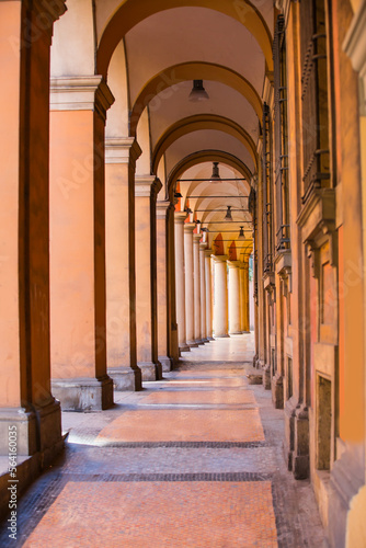 Narrow city street view traditional architectural features in Bologna  Italy