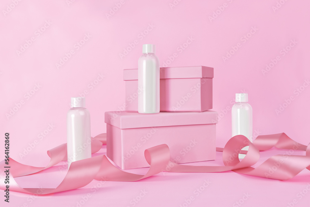 Valentine's Day styled photography mockup of white bottles on a pink background with pink lint ribbons and boxes. Valentine's Day styled photography mockup of white bottles on a pink background with pink lint ribbons and boxes.