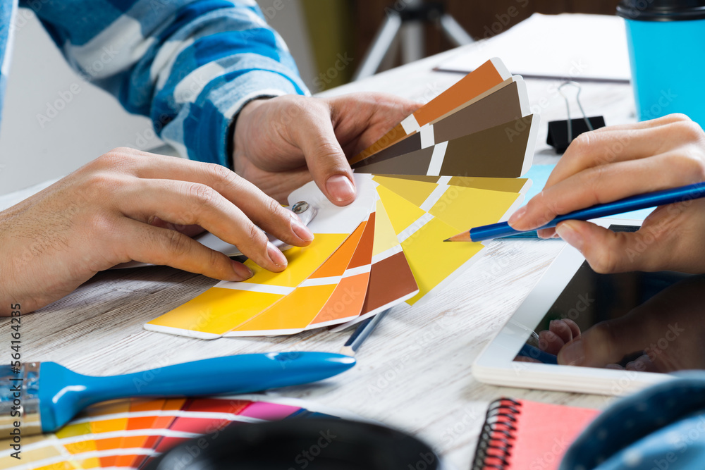 Interior designer choosing colors from swatches