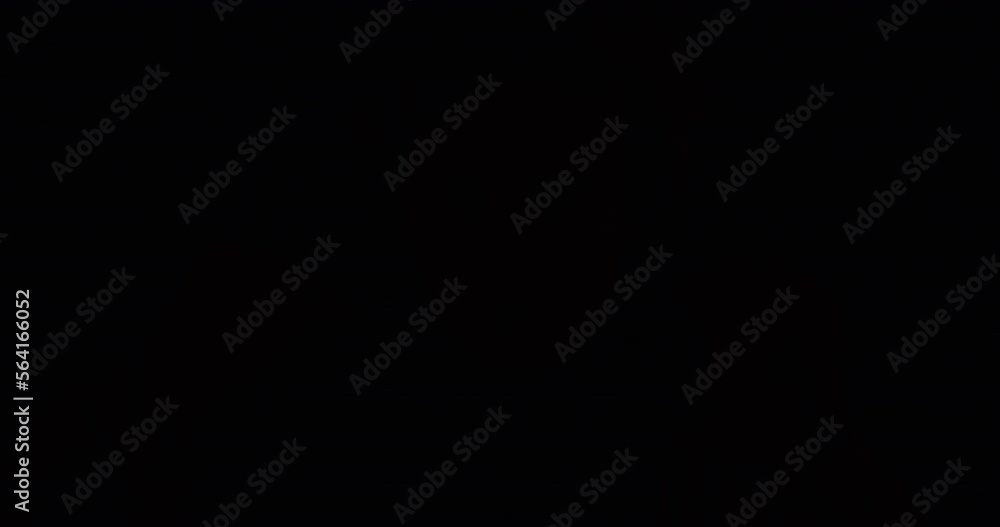 Close-up portrait of guy taking off hood and looking at camera with serious face in flashes of police light at night. Danger and accident concept. Close-up portrait of guy taking off hood and looking at camera with serious face in flashes of police light at night. Danger and accident concept.
