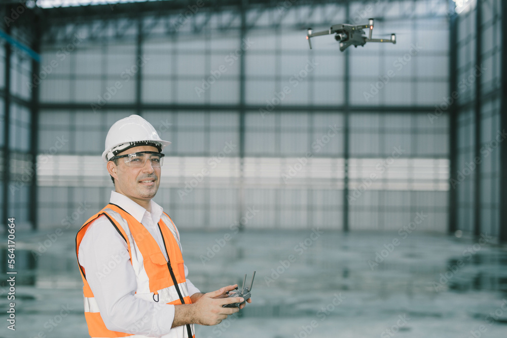 construction worker drone operated on a construction site , warehouse interior. construction worker drone operated on a construction site , warehouse interior.