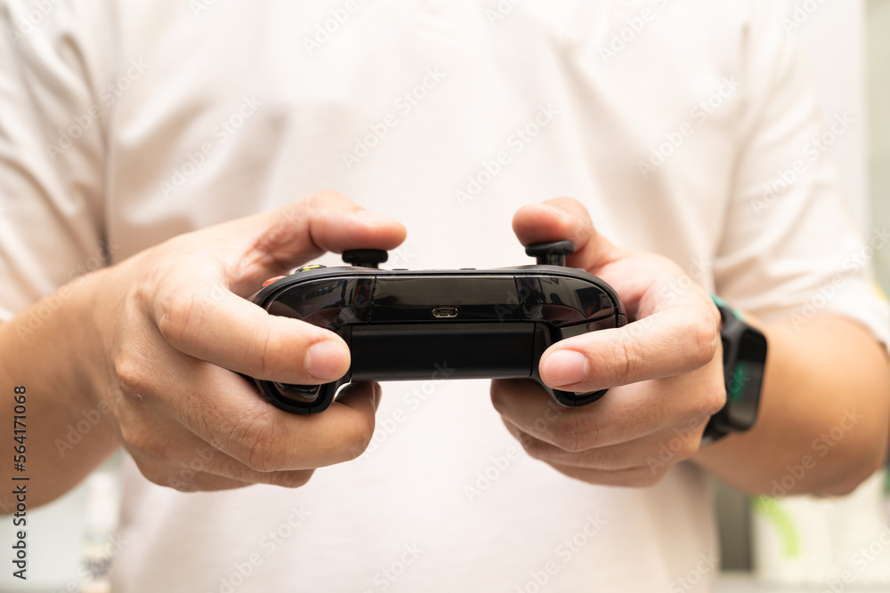 Black joystick in hands isolated on white background. Computer gaming technology play competition video game control confrontation concept. esport concept. Black joystick in hands isolated on white background. Computer gaming technology play competition video game control confrontation concept. esport concept.