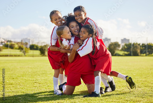 Soccer children, winner or happy for success, goal or wellness in match, game or fitness with smile on football field. Motivation, sport or kids celebrating in training, workout for teamwork exercise © Nina/peopleimages.com