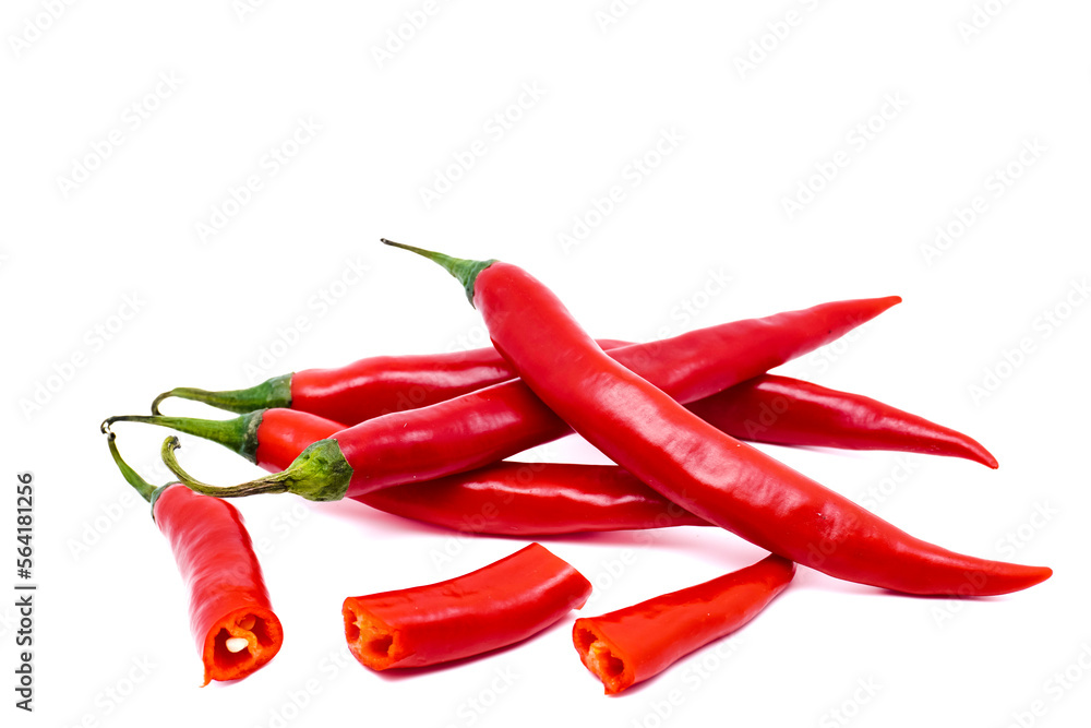 Red chili peppers with sliced isolated on white background. Ripe chili peppers with copy space. Raw food ingredient concept.