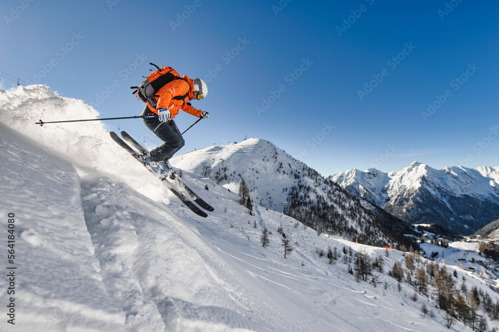 Off-piste skier near a ski area Off-piste skier near a ski area