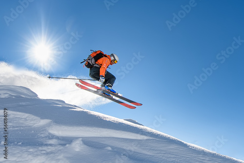 Skier at speed flying through the sky