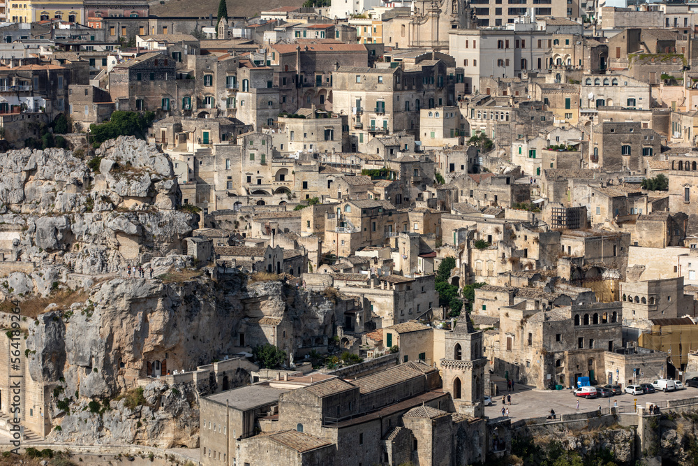  Panoramic view of Sassi di Matera a historic district in the city of Matera, well-known for their ancient cave dwellings from the Belvedere di Murgia Timone,  Basilicata, Italy