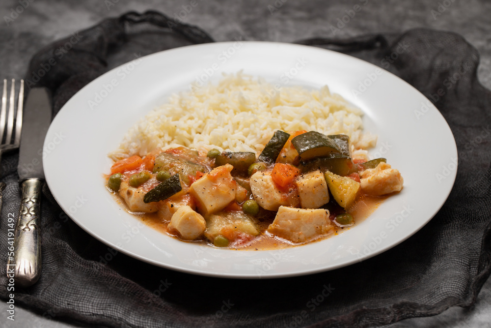squid stew with vegetables and boiled rice on plate squid stew with vegetables and boiled rice on plate