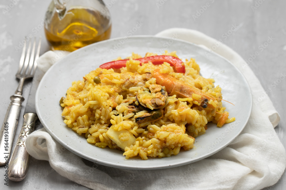 Classic dish of Spain, paella in plate Classic dish of Spain, paella in plate