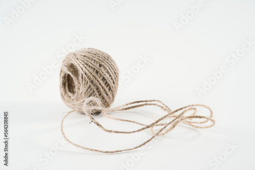 small ball of jute hemp string twine for all household and business tying tasks isolated on white