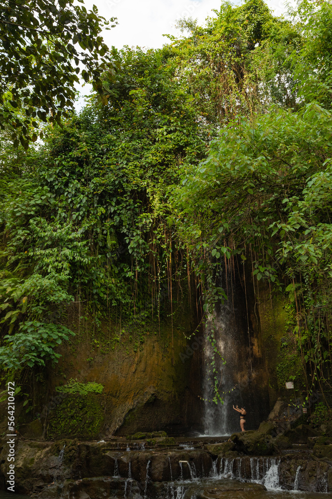 Uma Anyar waterfall, Bali, Indonesia. Jungle, forest, daytime with cloudy sky. Uma Anyar waterfall, Bali, Indonesia. Jungle, forest, daytime with cloudy sky.