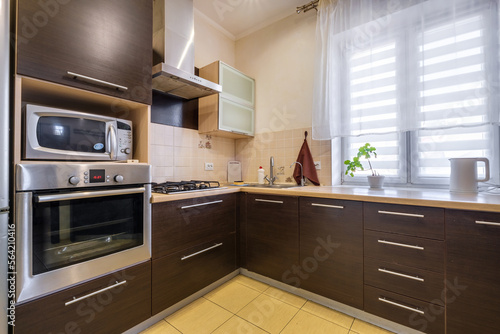 Interior of the modern luxure kitchen in studio apartments in minimalistic style