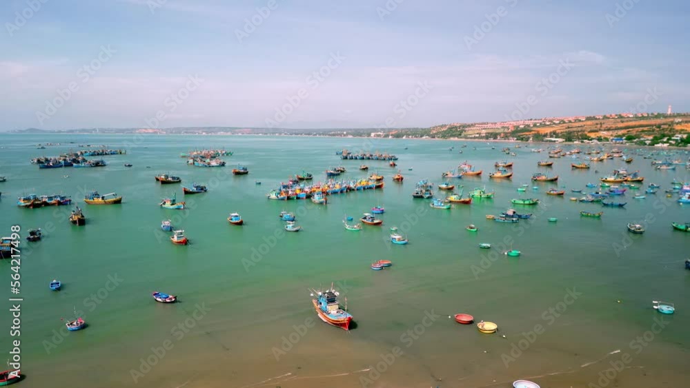 Fishing village in Mui Ne, Vietnam. Mui Ne Fishing Village, flying around several hundred fishing boats anchored to avoid storms, is a beautiful bay in central Vietnam. Asia fishing boats. 4K