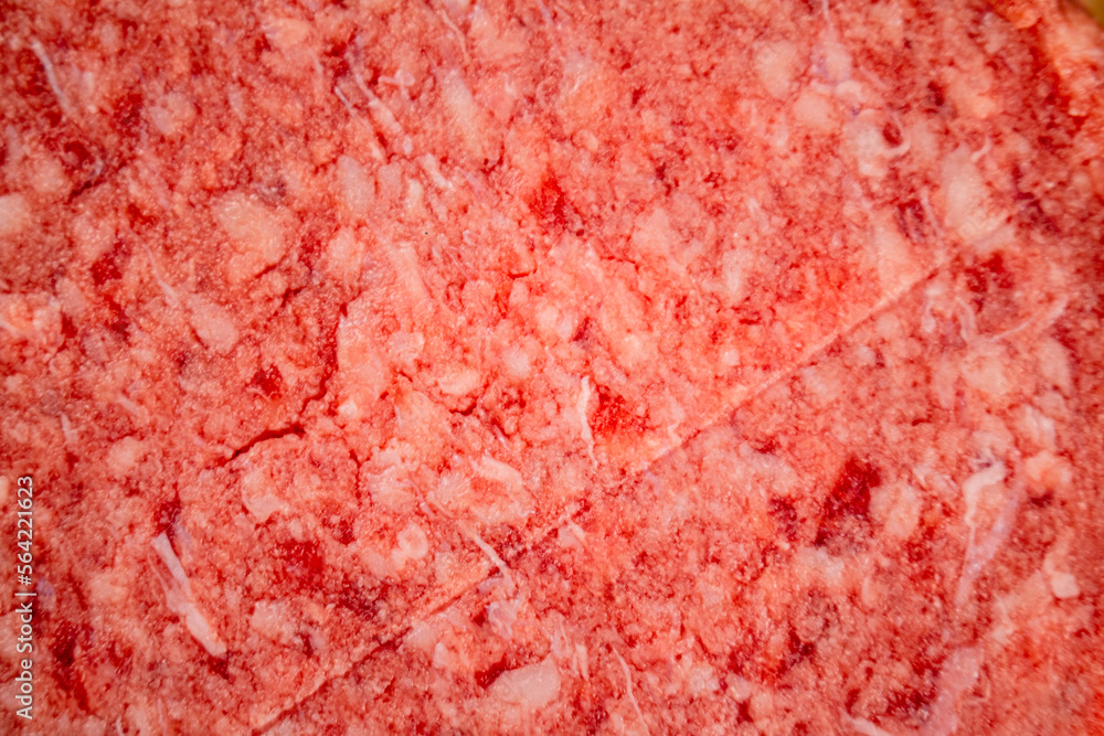 Raw burger. Macro background. The texture of the raw burger. Raw burger. Macro background. The texture of the raw burger.