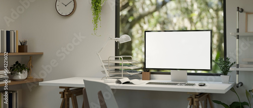 Minimal white home working room interior design with computer mockup against the window