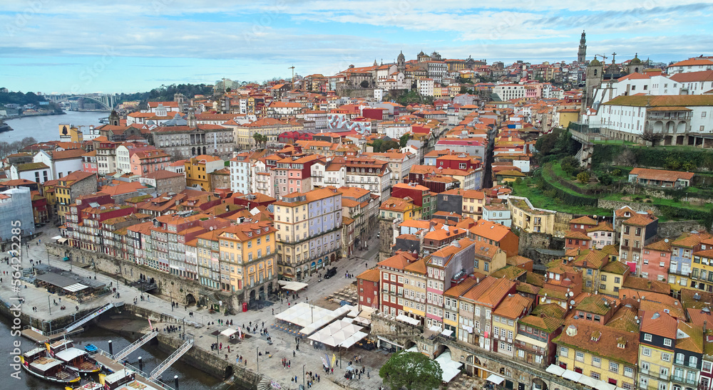 Porto, Portugal - 12.25.2022: Aerial view of the old city of Porto. Portugal old town ribeira aerial promenade view with colorful houses.