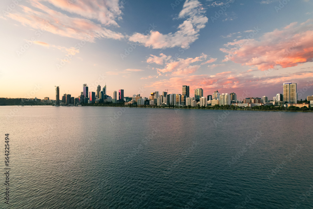 Perth cityscape at sunset looking across the Swan River.