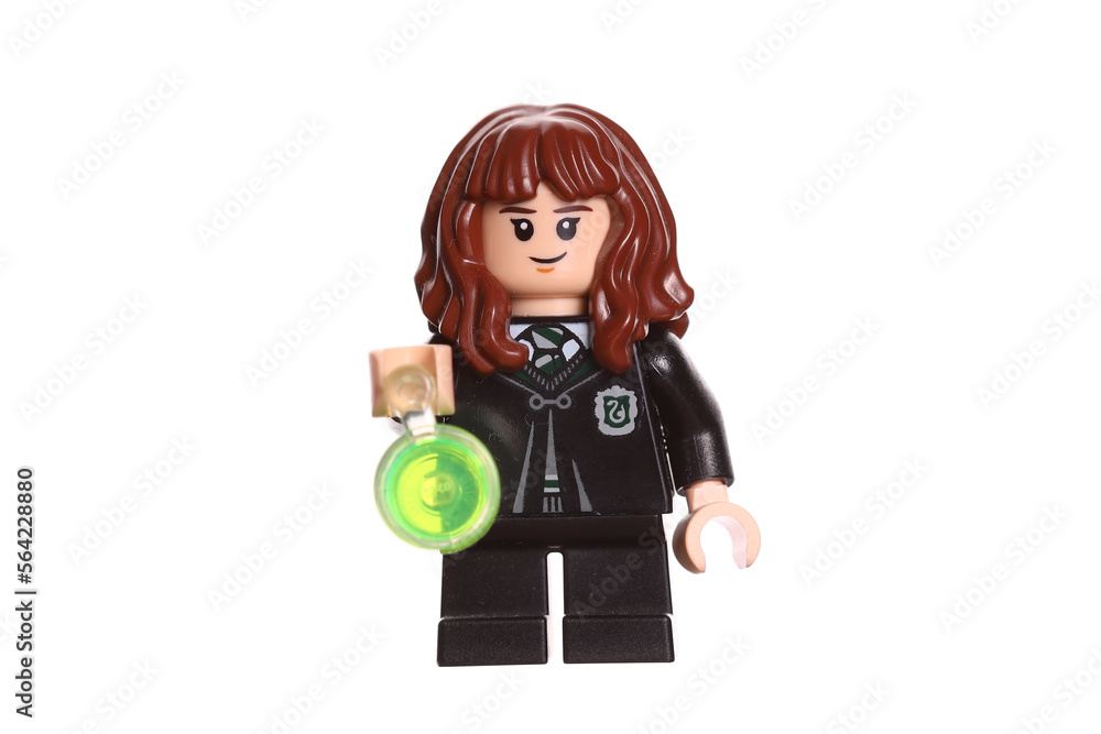 Fototapeta premium Russia Vyborg 01.22.2023 Lego figure Hermione Granger with goblet isolated on white background. Side view