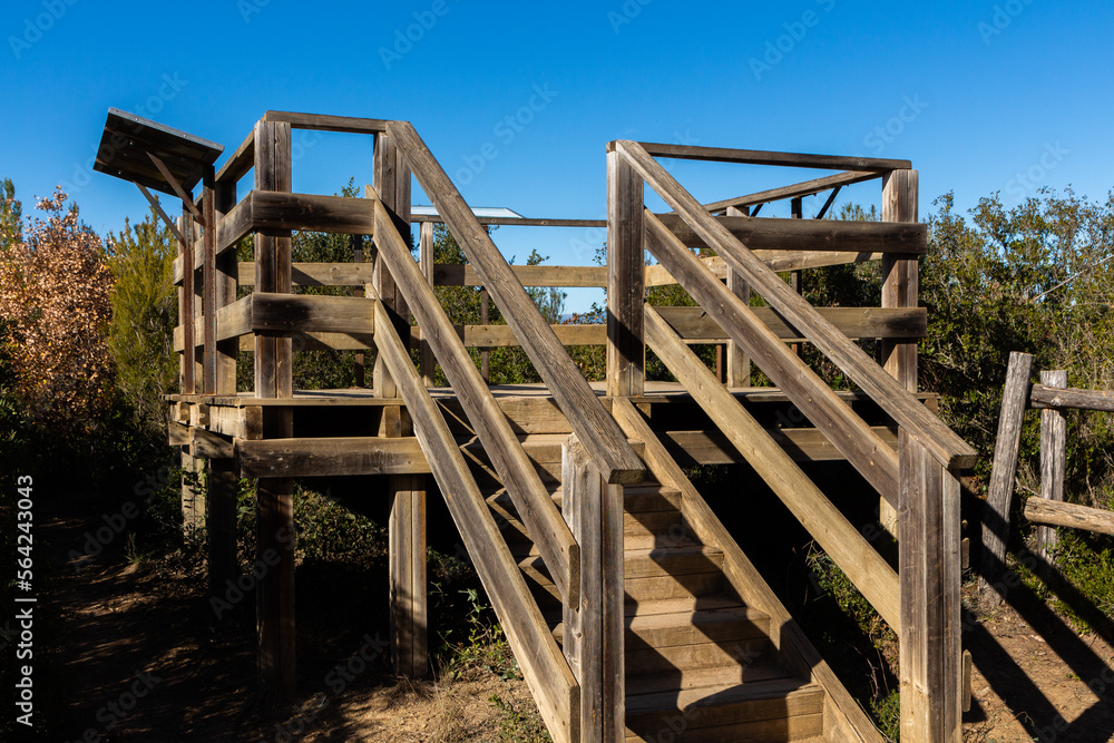Elevated wooden lookout with mountain stairs