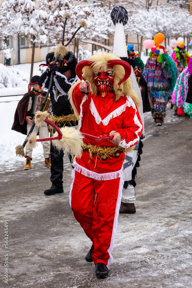 Gody Zywieckie - traditional winter parade of 'Dziady', 'Jukace', folk custom in Zywiec region, man dressed in traditional costume of devil performing on a street, Milowka, Poland