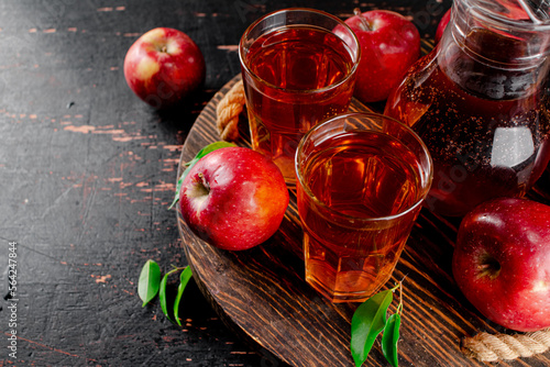 Apple juice on a wooden tray. 