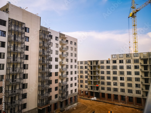tower crane builds prefabricated concrete apartment buildings
