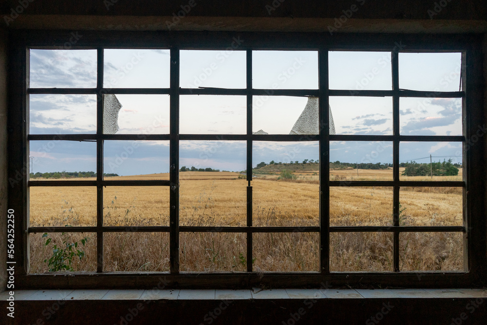 wheat fields view from broken window
