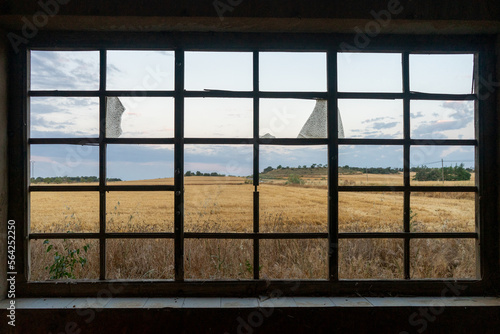 wheat fields view from broken window