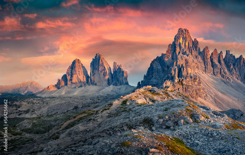 Astonishing morning view of Paternkofel and Tre Cime Di Lavaredo mpountain peaks. Breathtaking summer sunrise in Dolomiti Alps, South Tyrol, Italy, Europe. Beauty of nature concept background.