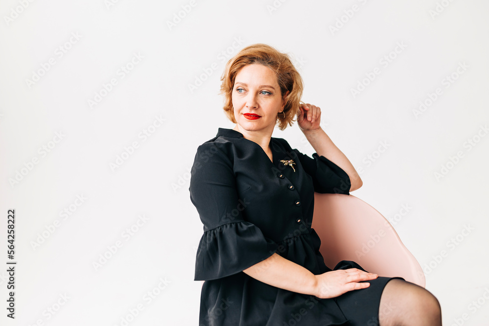 Beautiful woman portrait in light studio. Adult beauty age Beautiful woman portrait in light studio. Adult beauty age