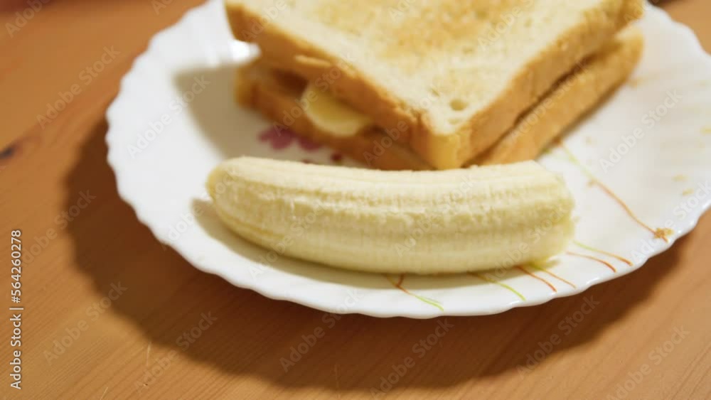Peanut butter and banana sandwich on a plate Peanut butter and banana sandwich on a plate