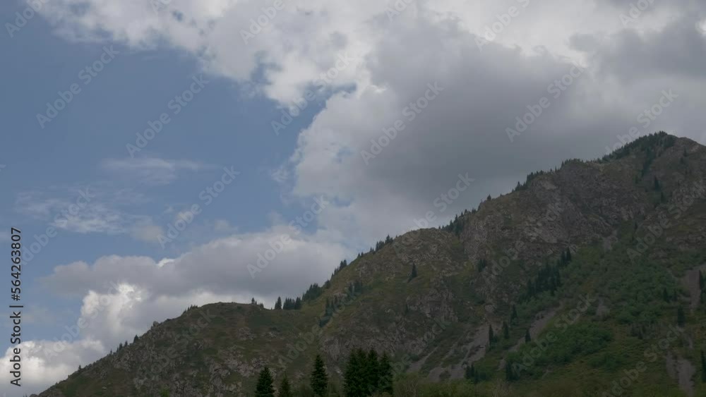 This stock video shows clouds over the mountain. This video will decorate your projects related to nature, mountains, clouds, travel, tourism. This stock video shows clouds over the mountain. This video will decorate your projects related to nature, mountains, clouds, travel, tourism.