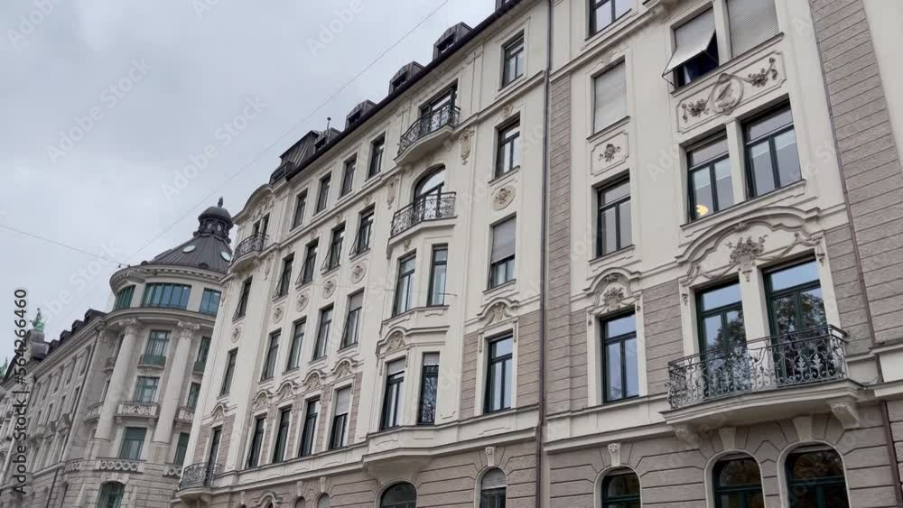 Upper class residential building facades in Munich city, Germany. Real estate business, classic architecture style, tourism concepts Upper class residential building facades in Munich city, Germany. Real estate business, classic architecture style, tourism concepts