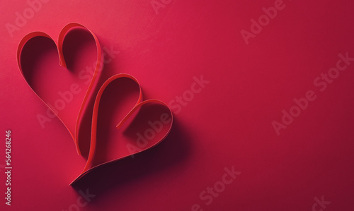 Love and Valentine's day concept made from paper hearts on dark red background.