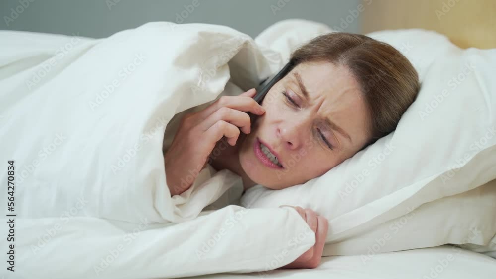 Sick blond woman blowing running nose sneezing and coughing laying on the warm bed in the bedroom Unhealthy female under the blanket getting flu virus symptom Cold and fever concept Sick blond woman blowing running nose sneezing and coughing laying on the warm bed in the bedroom Unhealthy female under the blanket getting flu virus symptom Cold and fever concept