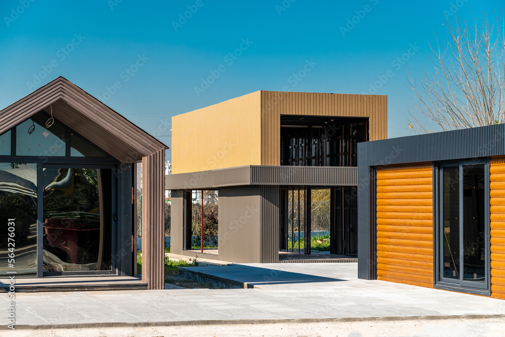 Newly built metal framed building with siding. Construction of a new tiny house. selective focus