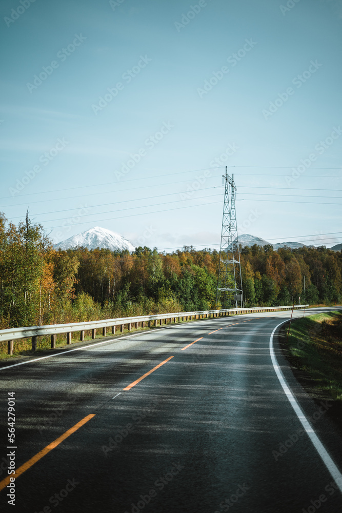 Empty road and stunning mountains in Norway on a beautiful autumn day