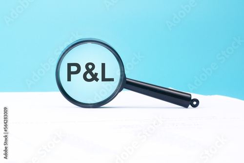 look at the text P and L through a magnifying glass on a blue and white background