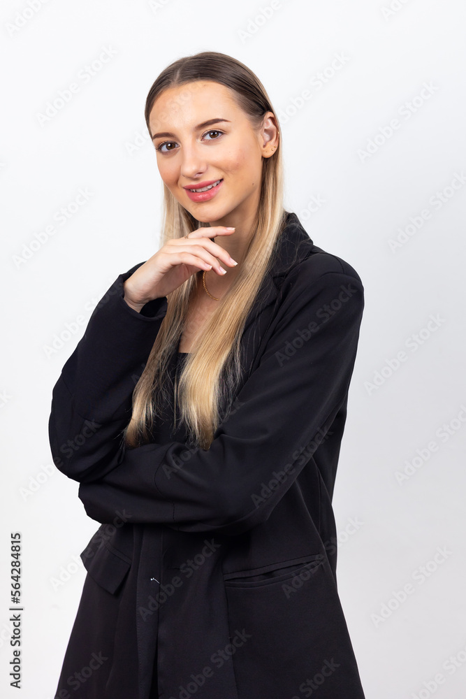 Happy young caucasian female looking at camera. Professional company business woman over white wall background Happy young caucasian female looking at camera. Professional company business woman over white wall background