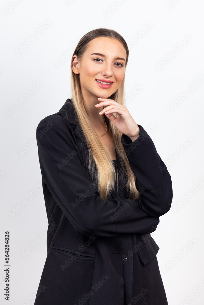 Happy young caucasian female looking at camera. Professional company business woman over white wall background Happy young caucasian female looking at camera. Professional company business woman over white wall background