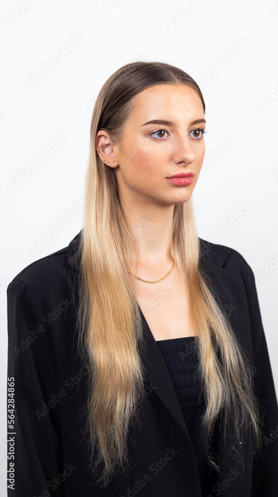 Happy young caucasian female looking at camera. Professional company business woman over white wall background Happy young caucasian female looking at camera. Professional company business woman over white wall background