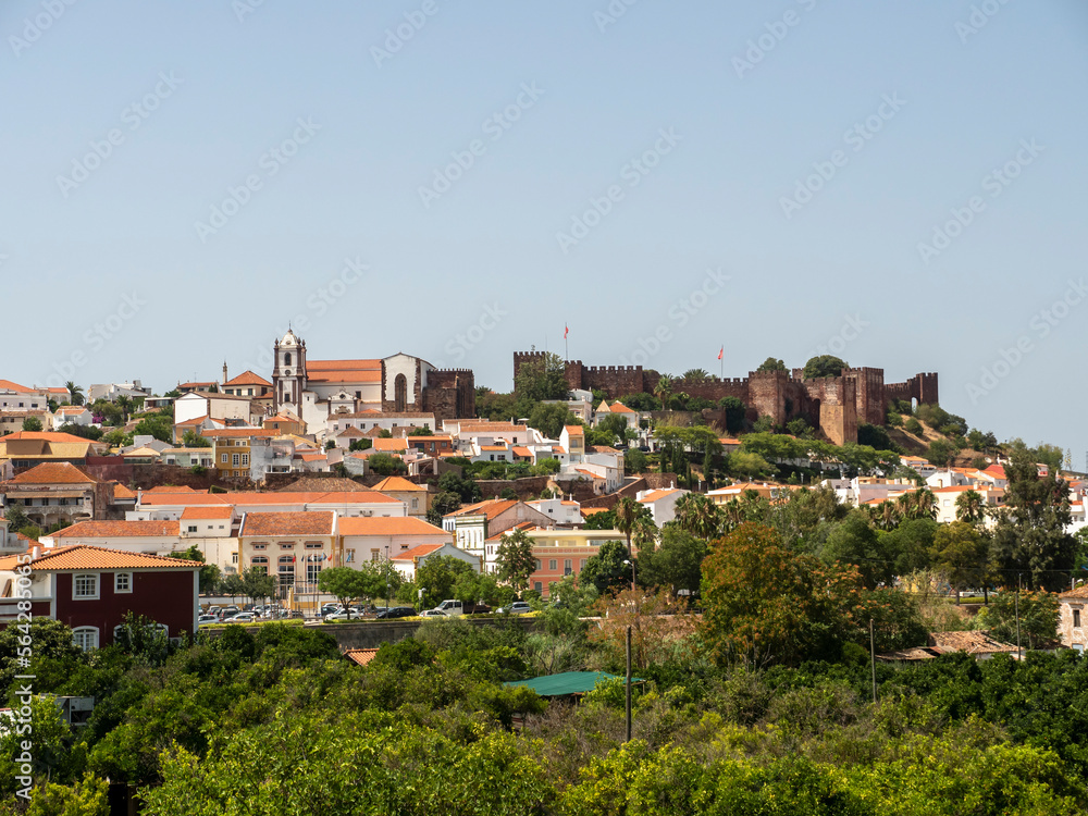 Portugal, Algarve, Cityscape of Silves with Moorish Castle and Cathedral on top of the hill