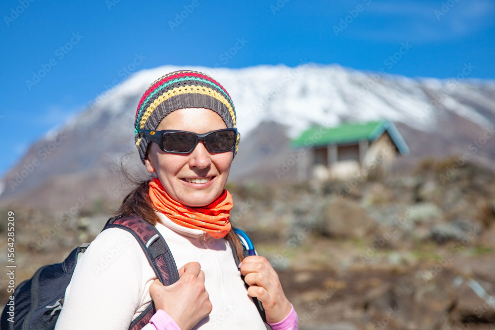 Female backpacker on the trek to Kilimanjaro mountain.