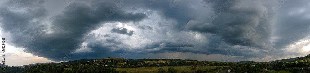 Landscape of dark clouds forming on stormy sky during thunderstorm over rural area Landscape of dark clouds forming on stormy sky during thunderstorm over rural area