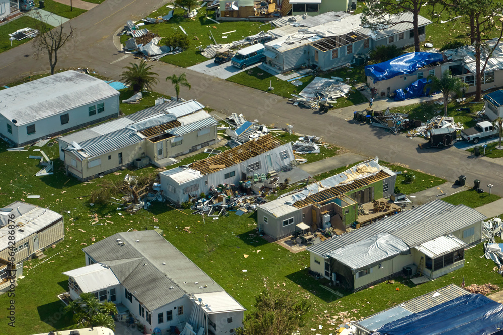 Severely damaged by hurricane Ian houses in Florida mobile home residential area. Consequences of natural disaster Severely damaged by hurricane Ian houses in Florida mobile home residential area. Consequences of natural disaster